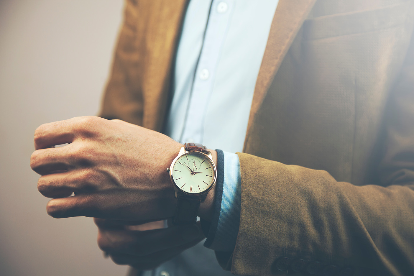 Man with watch on showing.